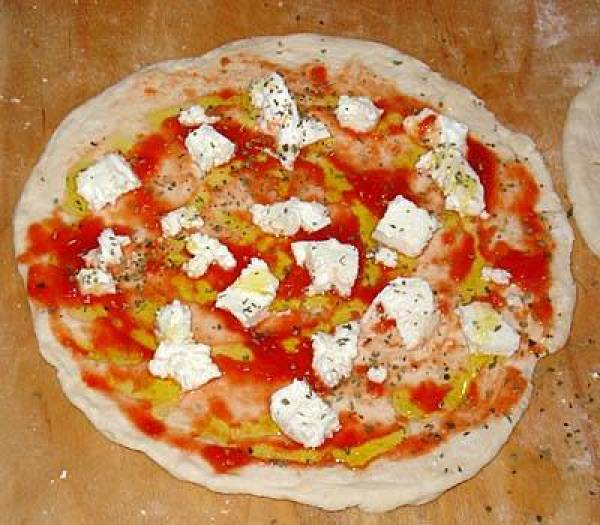 Preparing Margherita pizza