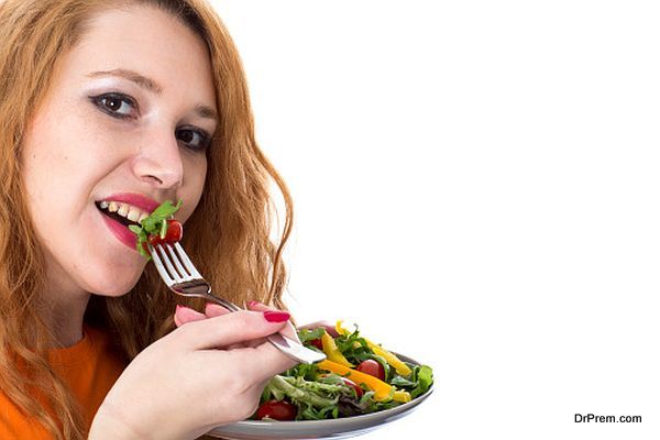 Happy Young Woman Eating Sprout Salad 