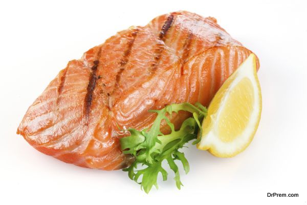 Grilled salmon with lemon isolated on white