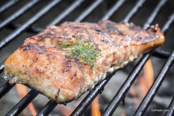 Baked salmon on the grill with fire