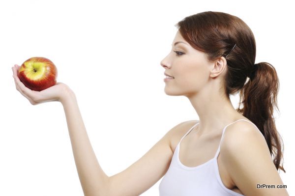 beautiful woman with apple - isolated on white background