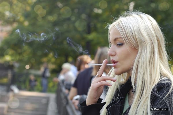 Girl smoking outdoors
