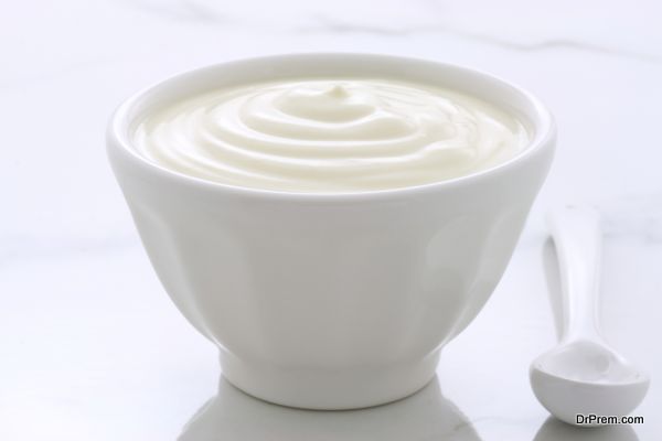 Delicious, nutritious and healthy fresh plain yogurt on vintage italian carrara marble setting.