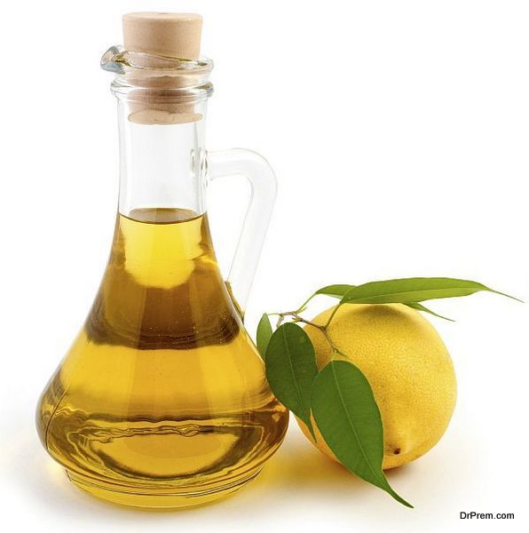 An image of a bottle of olive oil and lemon